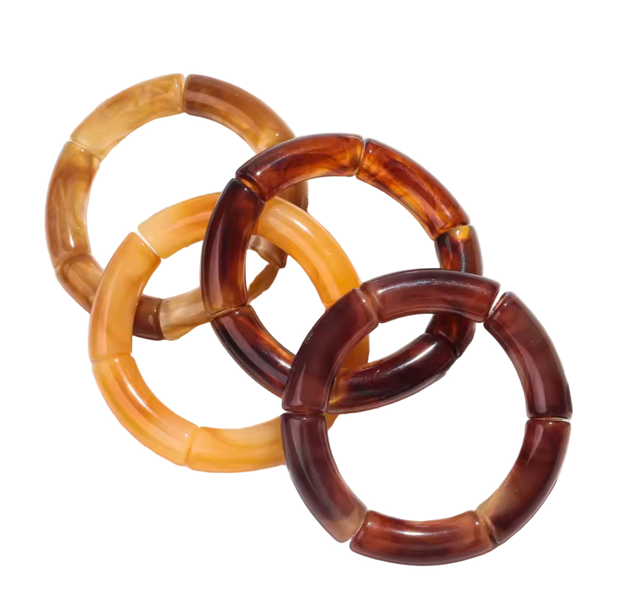 Three interlocking tortoiseshell bangles on a light background